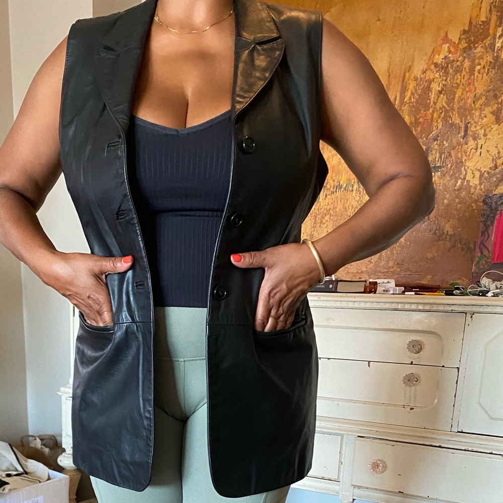 Leather motorcycle jacket, 3 button, 2 front pockets, back tie